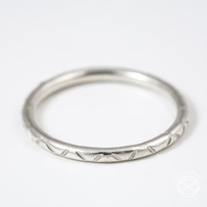 silver stacking rings with stamped designs and patterns